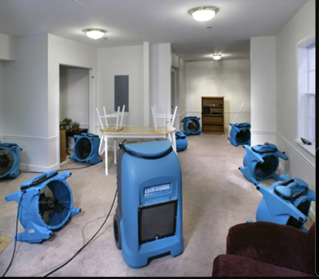 Air movers and dehumidifier setup for Water Damage Restoration in Chatham